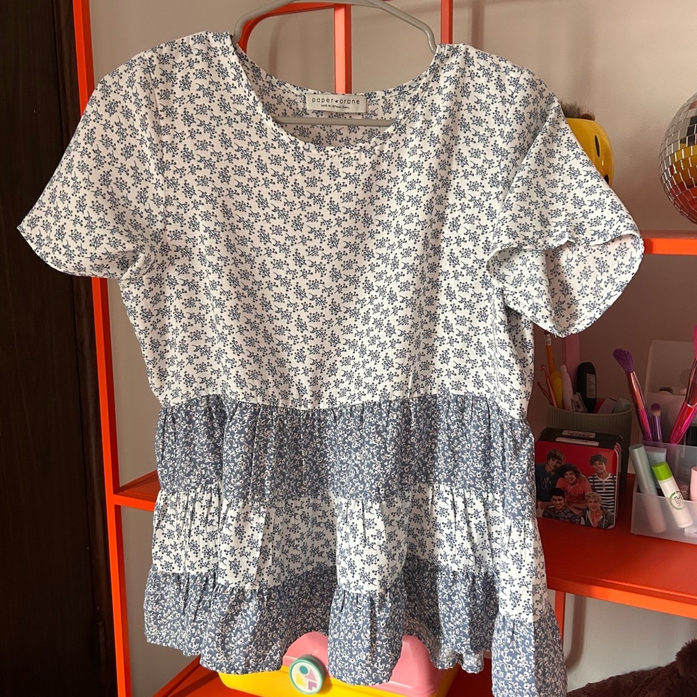 White and blue patterned blouse